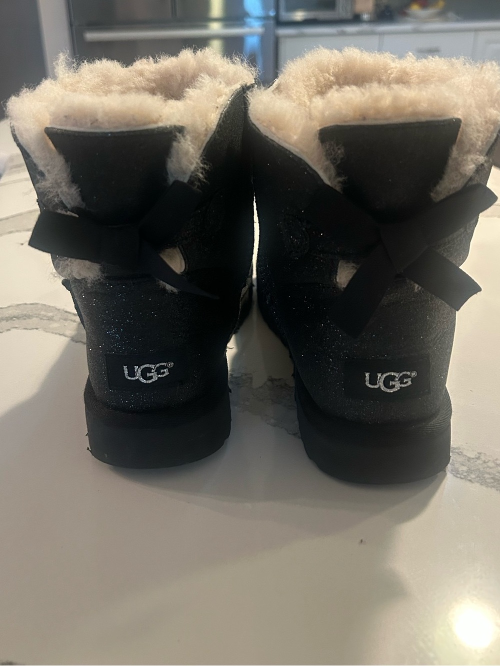 EUC UGG Women’s Bailey Bow Sparkle Glitter Sheepskin Boots Color Black Size US 8